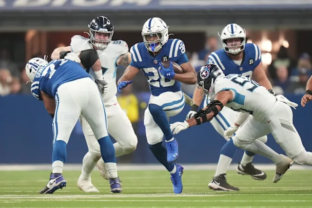 Jonathan Taylor runs through the Titans line
