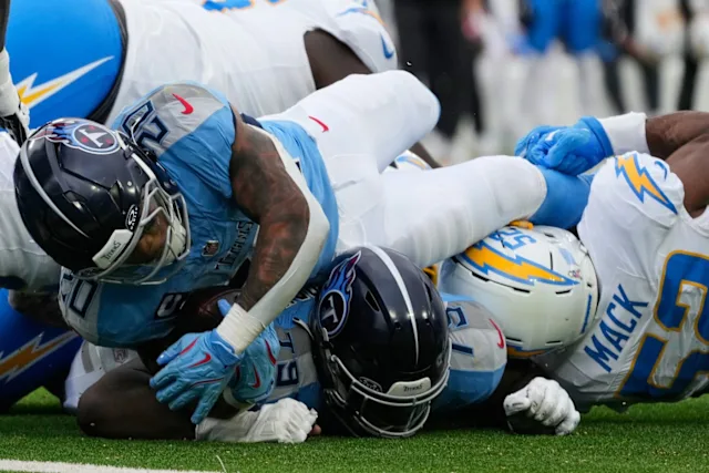 The Los Angeles Chargers stop the Tennessee Titans during a running play a run