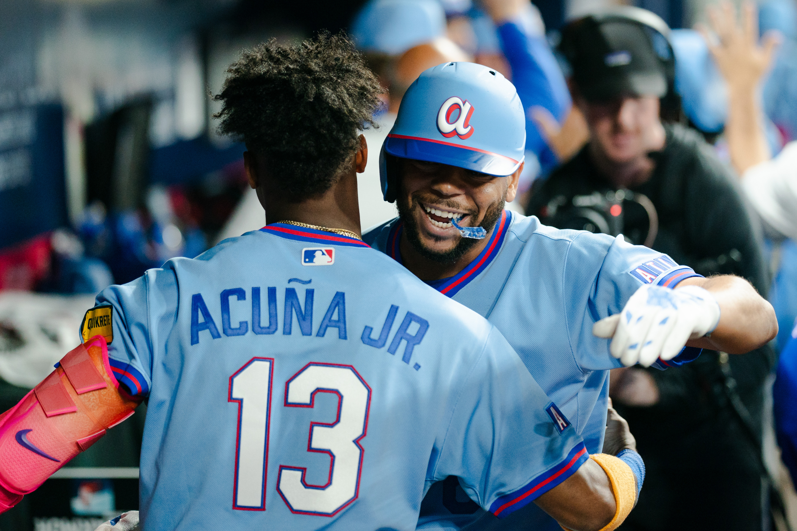 Ronald Acuna Jr. celebrates with Dominic Smith after Smith's home run