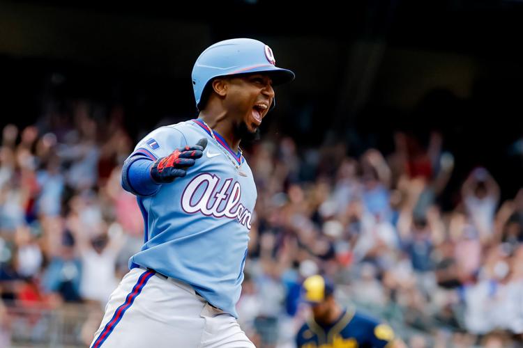Ozzie Albies celebrates as he hits home run