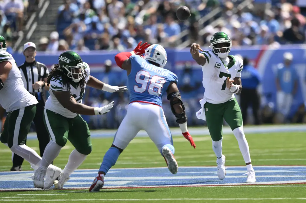 Geno Smith attempts a pass against the Titans