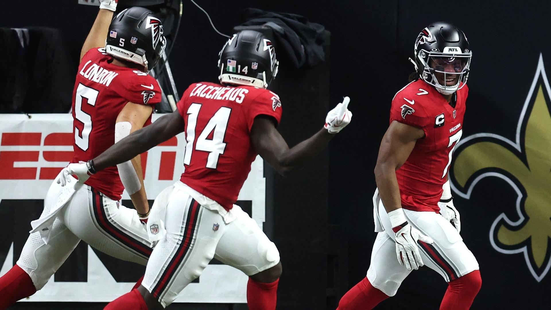 The Falcons celebrate after a Bijan Robinson touchdown